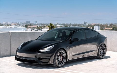 Tesla Model 3 Performance, lowered with Unplugged Performance Dual Rate Lowering springs, riding on Satin Titanium UP-03 wheels to enhance both handling and aesthetics.